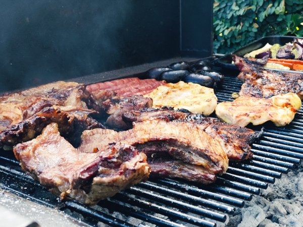What's the Secret to a Tender and Juicy Argentine Asado with Authentic Side Dishes?
